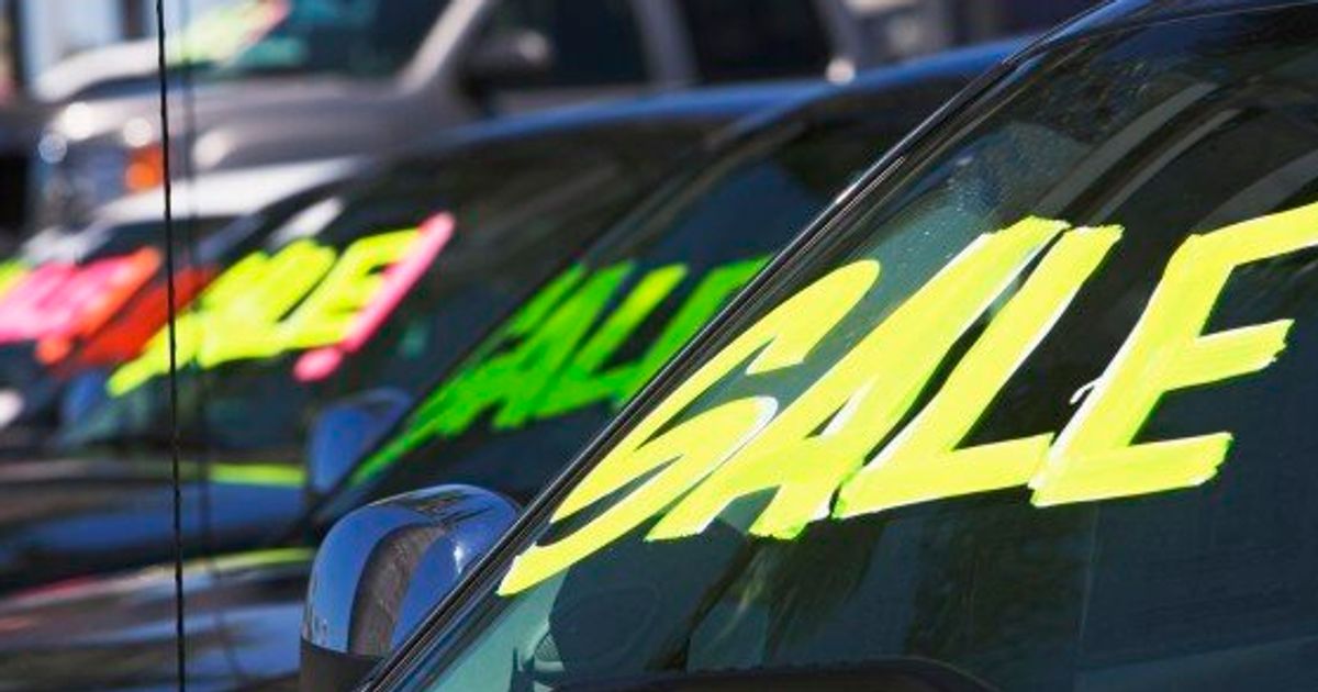 What are some common scams to be aware of when buying a used car?